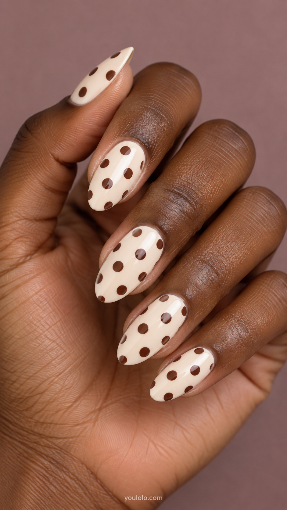 Brown polka dot nails — chocolate dots on a cream base