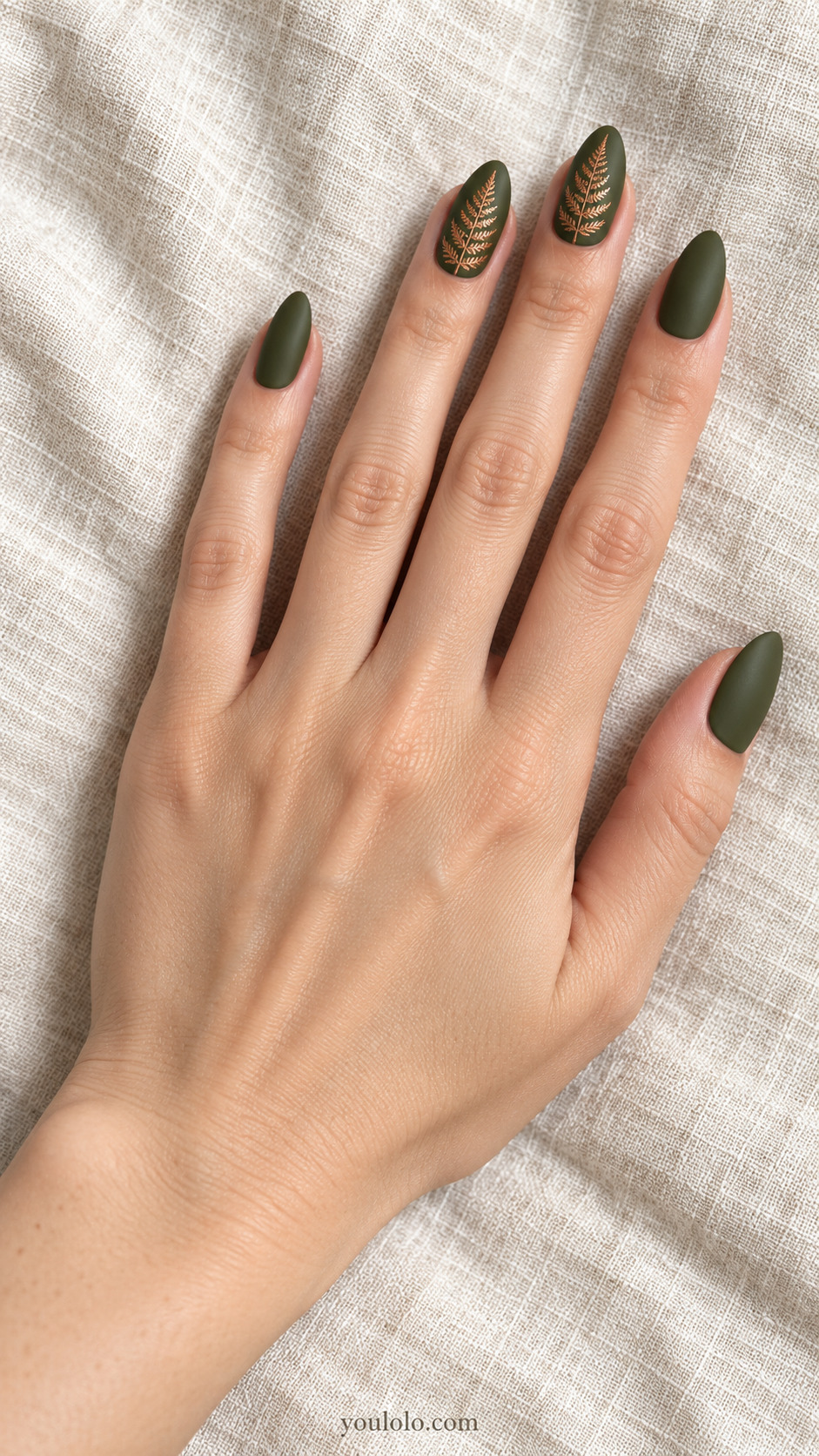 Botanical fall almond nails: Copper Fern Silhouette — Medium almond nails; matte olive base with fine copper fern fronds on two accent nails, solid olive others.