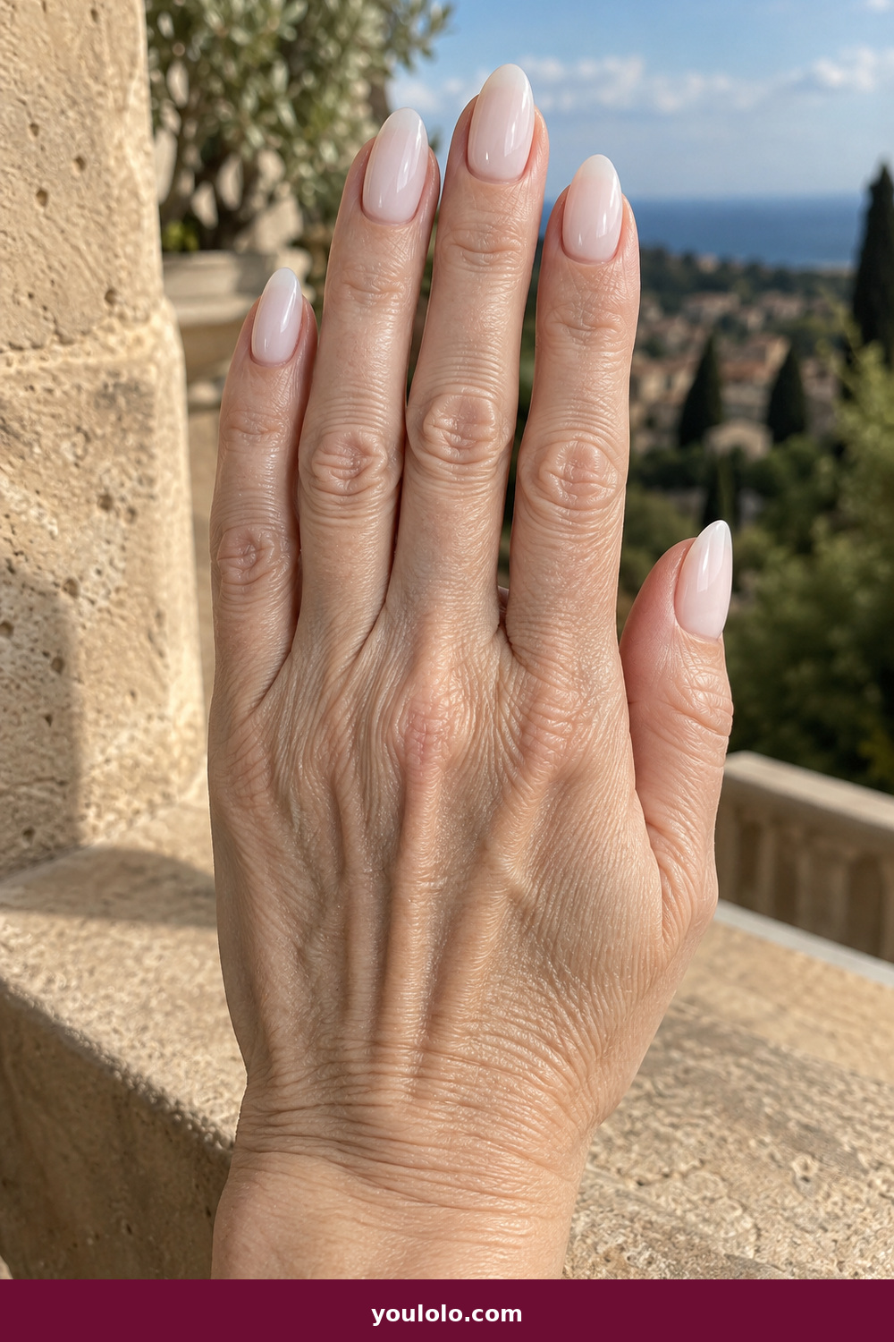 Elegant Almond Nails idea 1: Porcelain Almond, medium almond nails in luminous porcelain white with a translucent edge