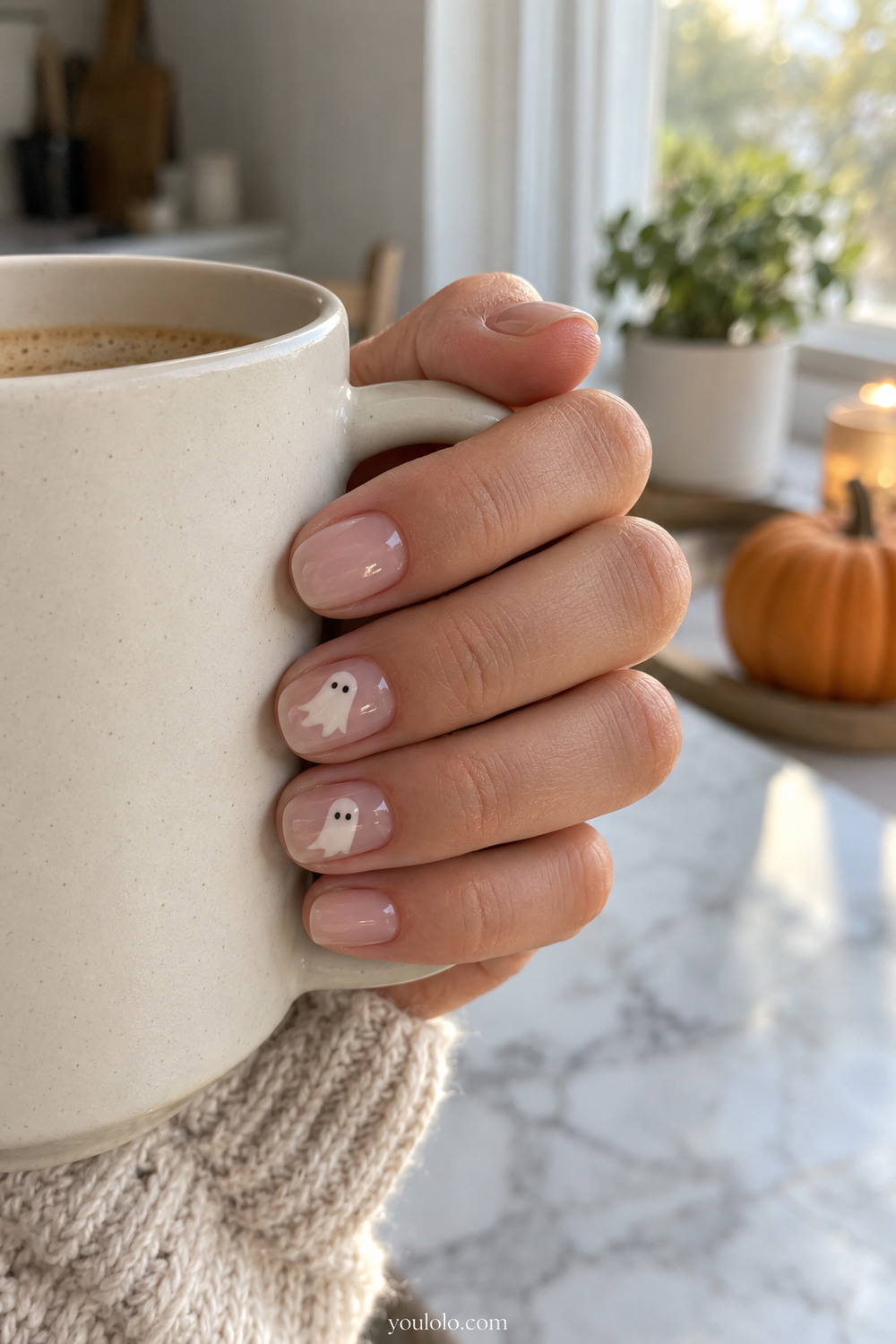 Short Halloween Nails with tiny white ghosts on a milky nude base
