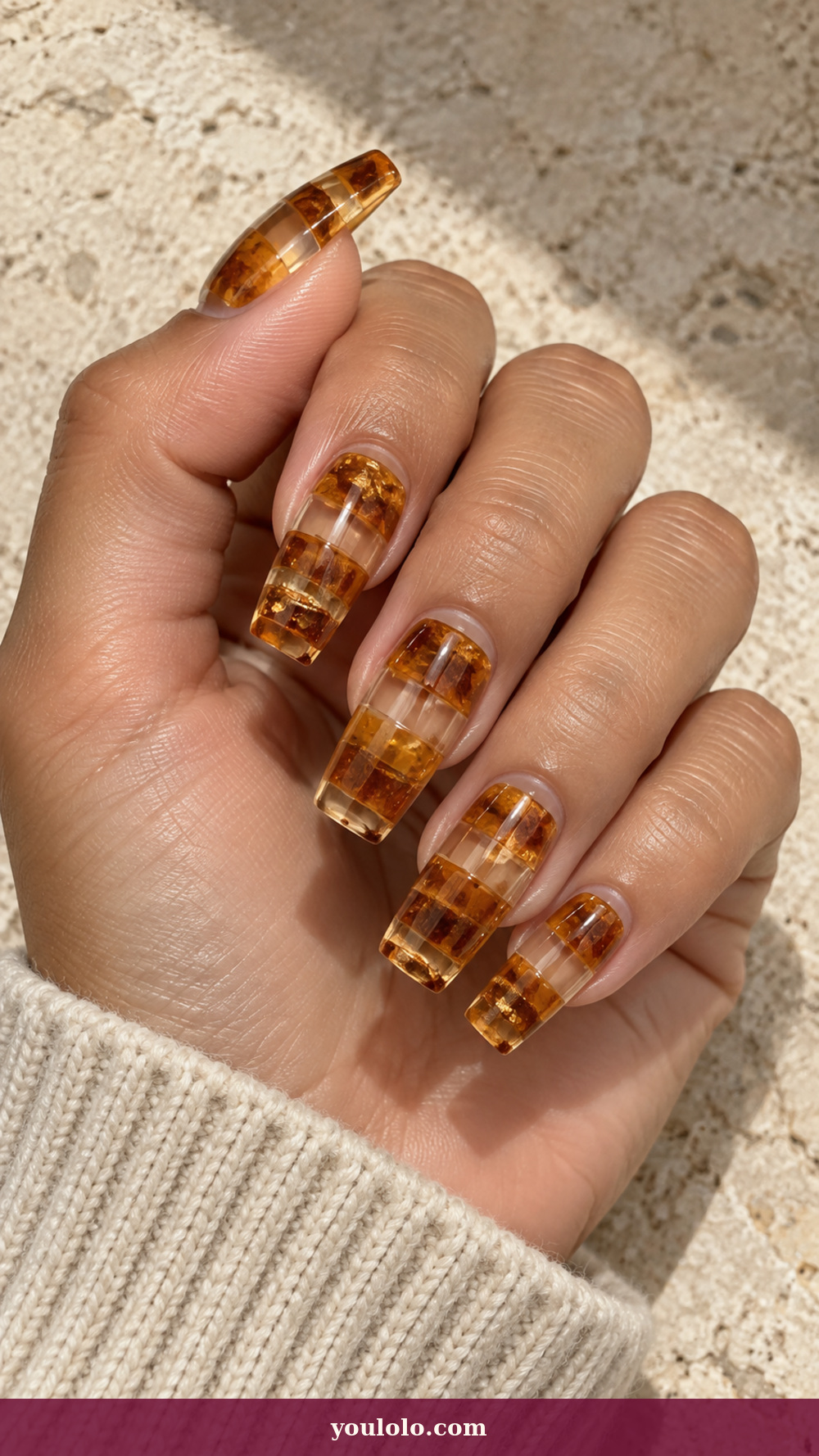 Acrylic Nails Ideas idea 2: Amber Resin Blocks on a realistic feminine hand