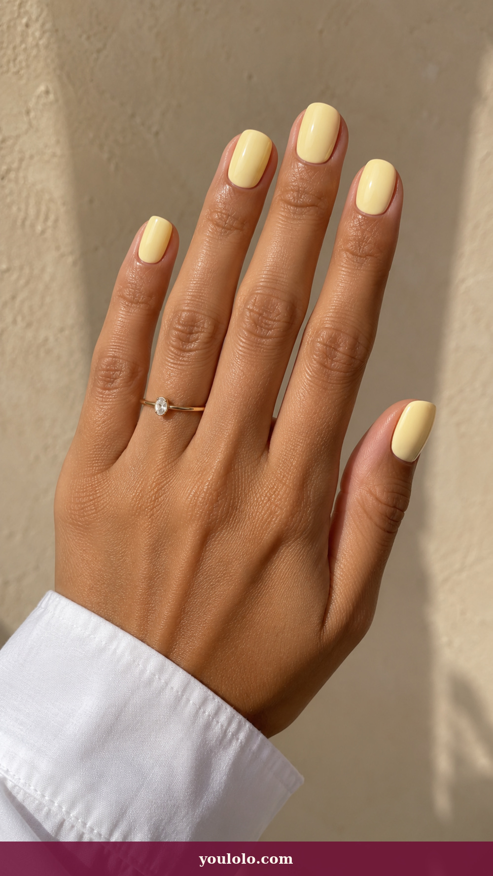 Simple Spring Nails idea 2: Buttercream Gloss on a realistic feminine hand