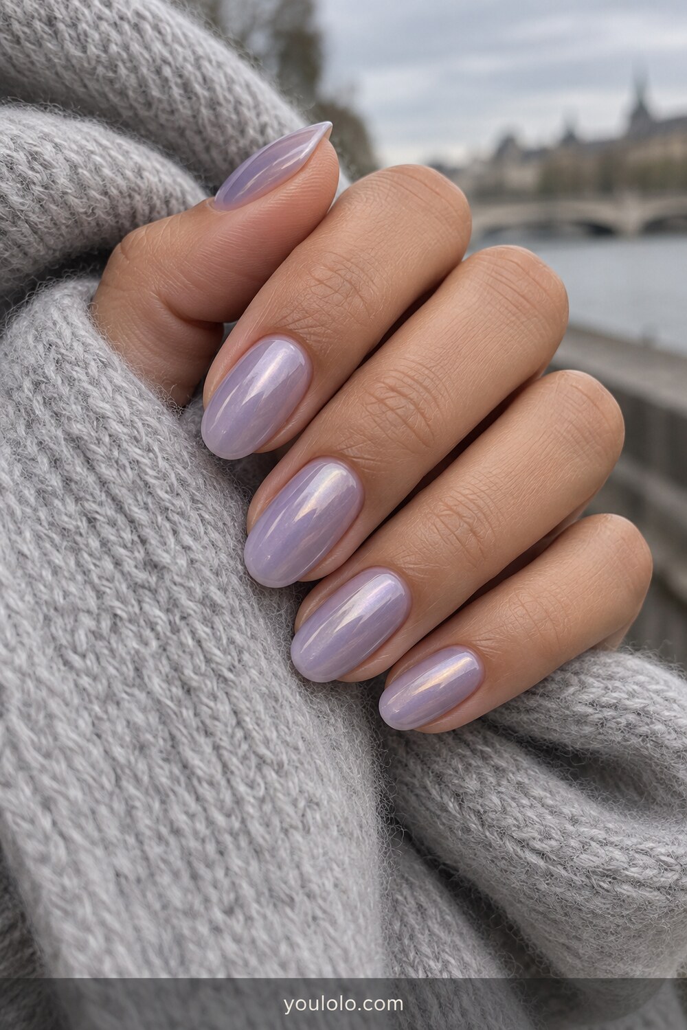 Cloudy lavender chrome oval manicure in natural light