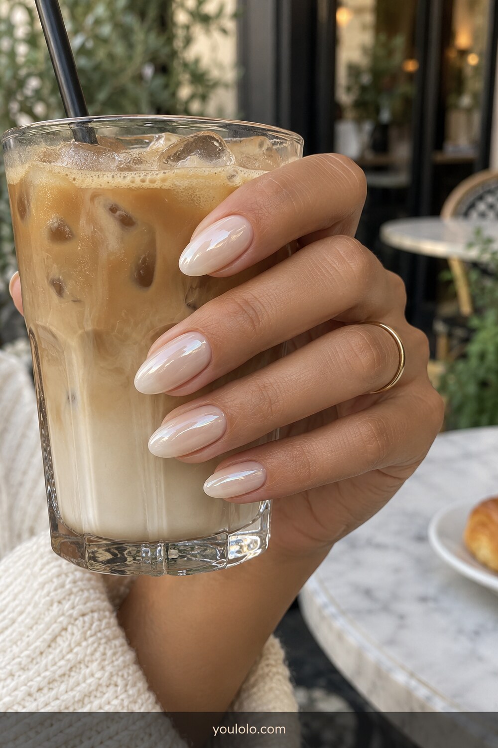 Glazed almond milk chrome manicure in café light