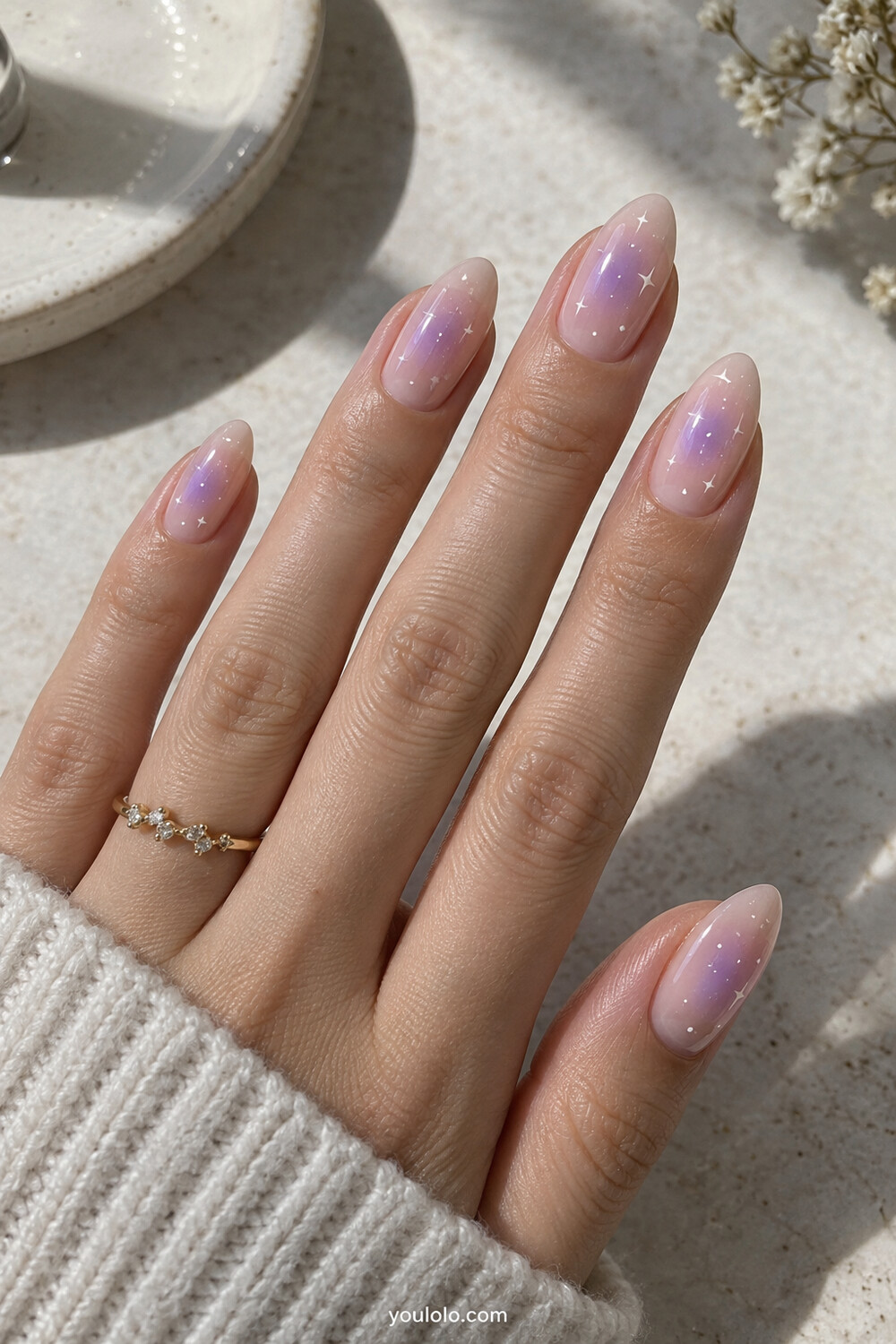 Soft lavender aura manicure with tiny white star details