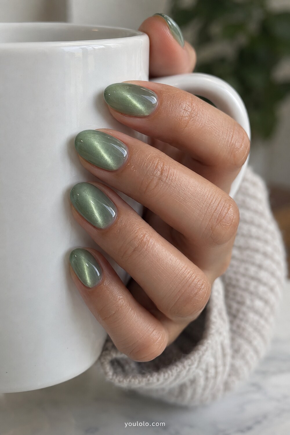 Olive green chrome manicure inspired by polished jade