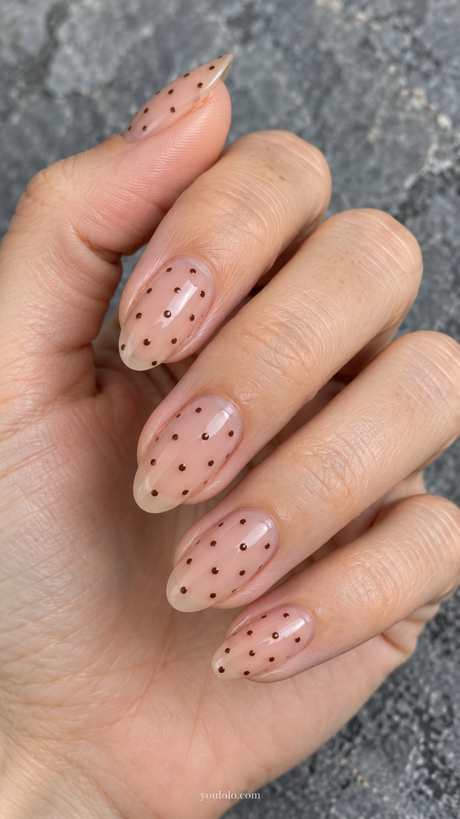 Tiny espresso dots on sheer nude manicure