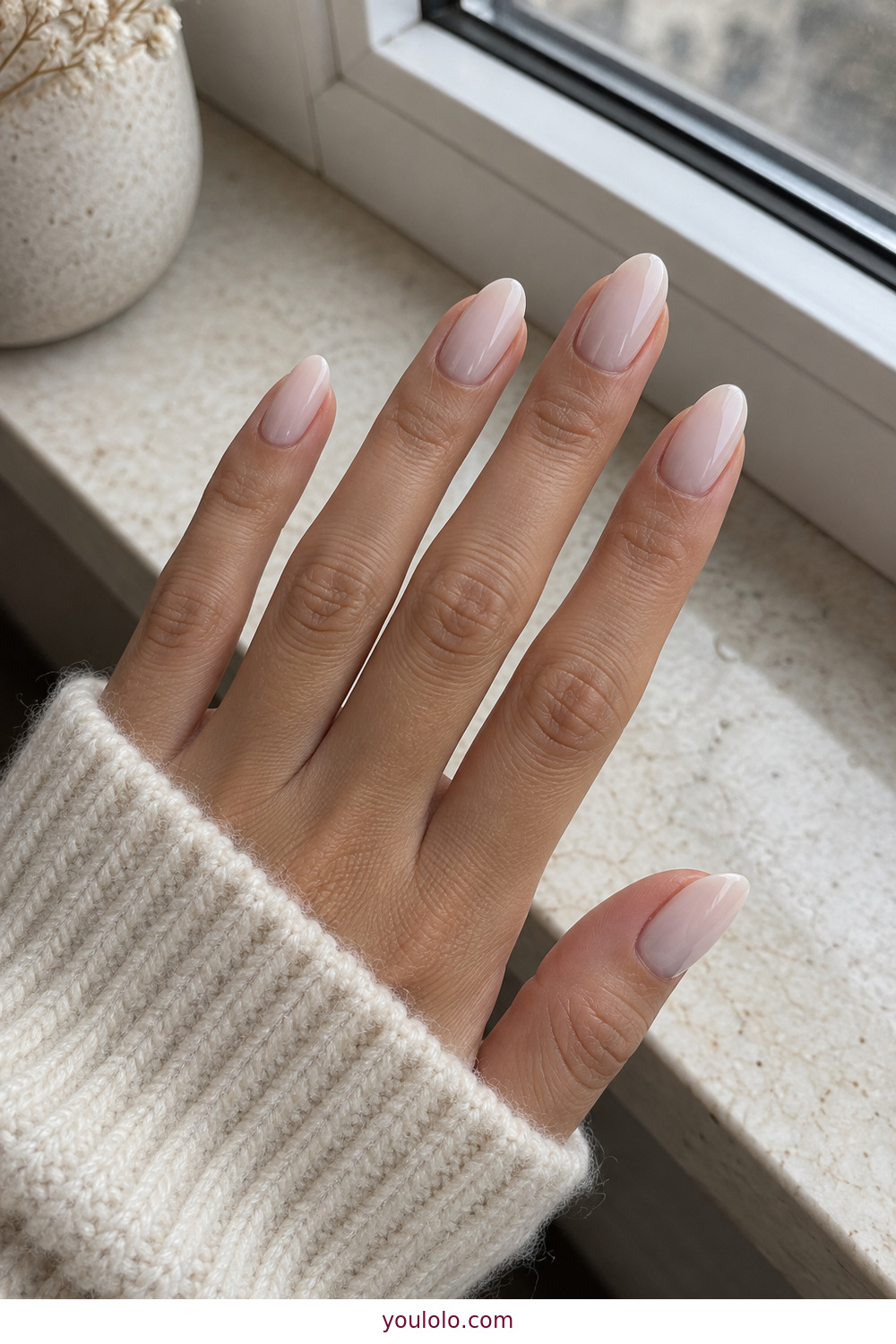 Blush toned milky white manicure on almond nails