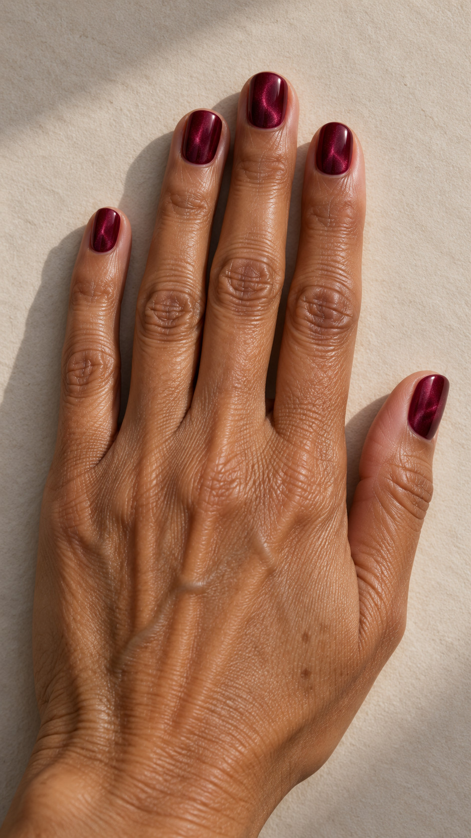 Velvet Nails idea 3: Merlot Reflection manicure on a realistic feminine hand