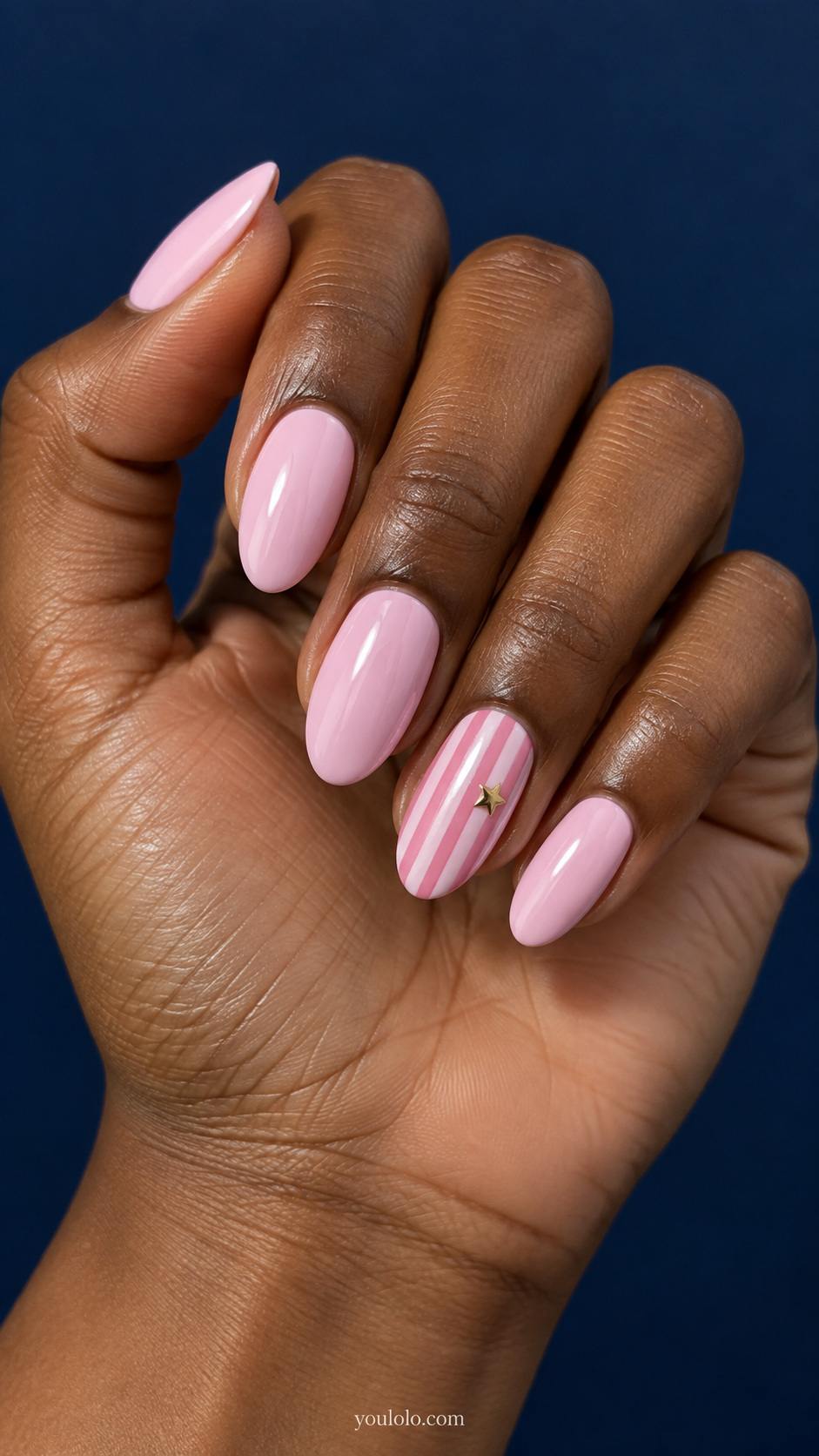 Pink striped nails — pink stripes with a single gold star