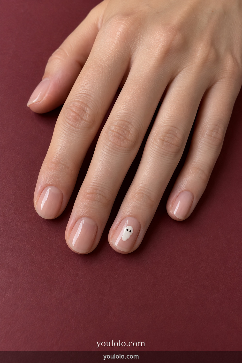 Tiny white ghost accent on nude short nails