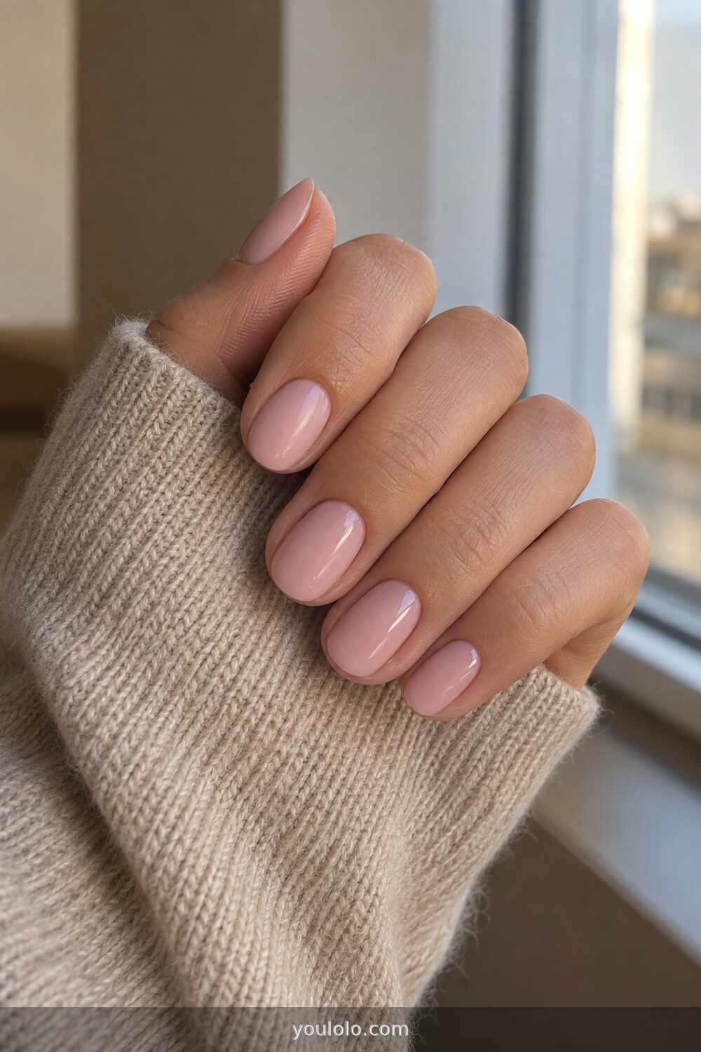 Ballet pink short oval nails with glossy finish