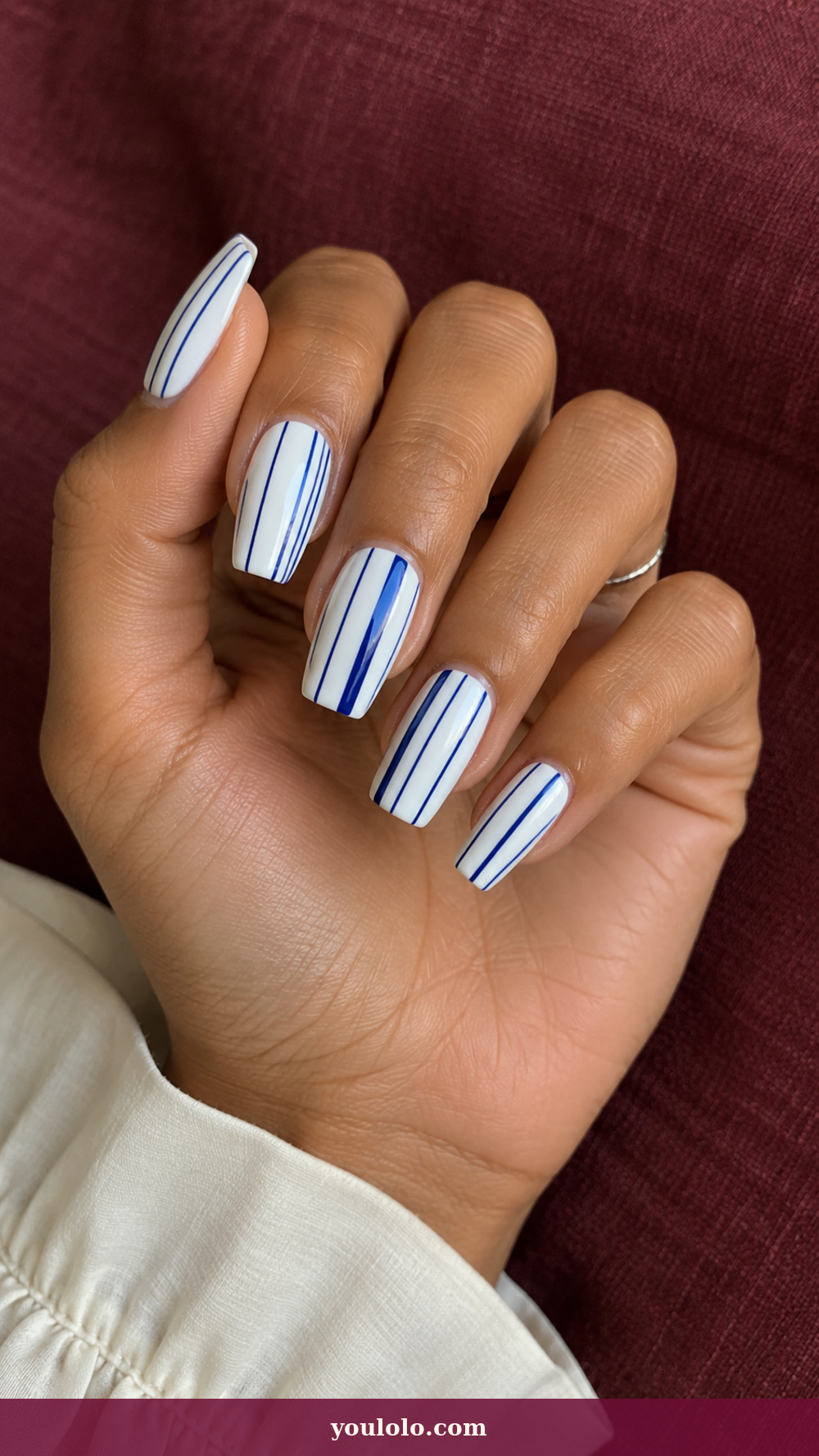 Long Square Nails idea 4: Cobalt Barcode on a realistic feminine hand