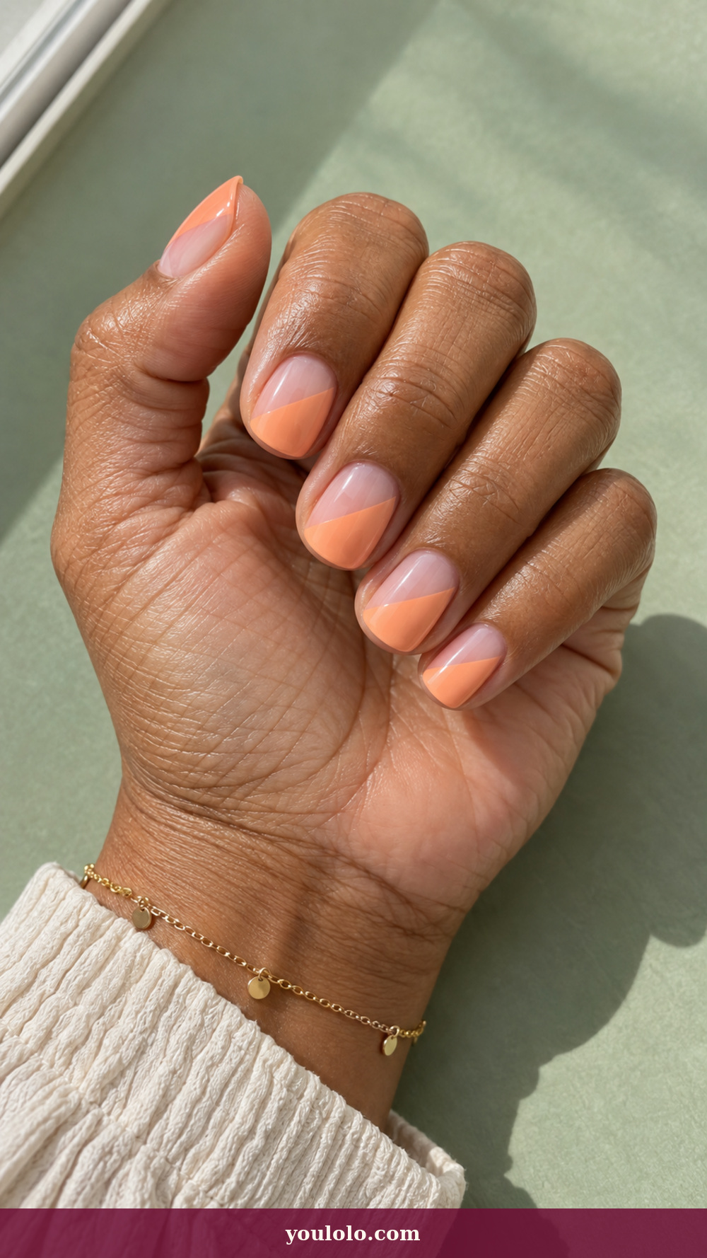 Simple Spring Nails idea 4: Sorbet Diagonal on a realistic feminine hand