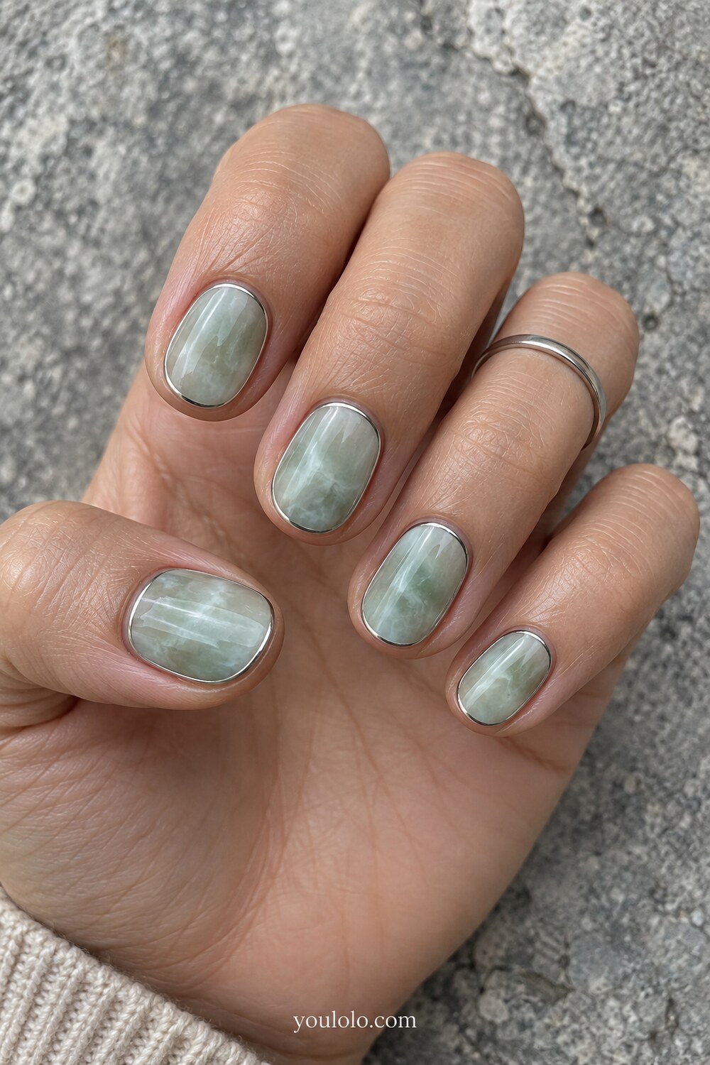 Watery aqua green marble art on natural rounded nails