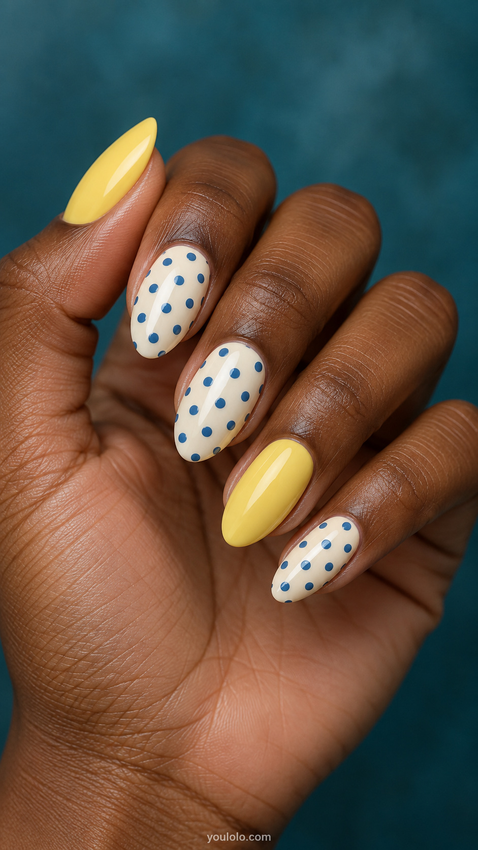 Butter yellow nails — blue dots on ivory with a yellow accent