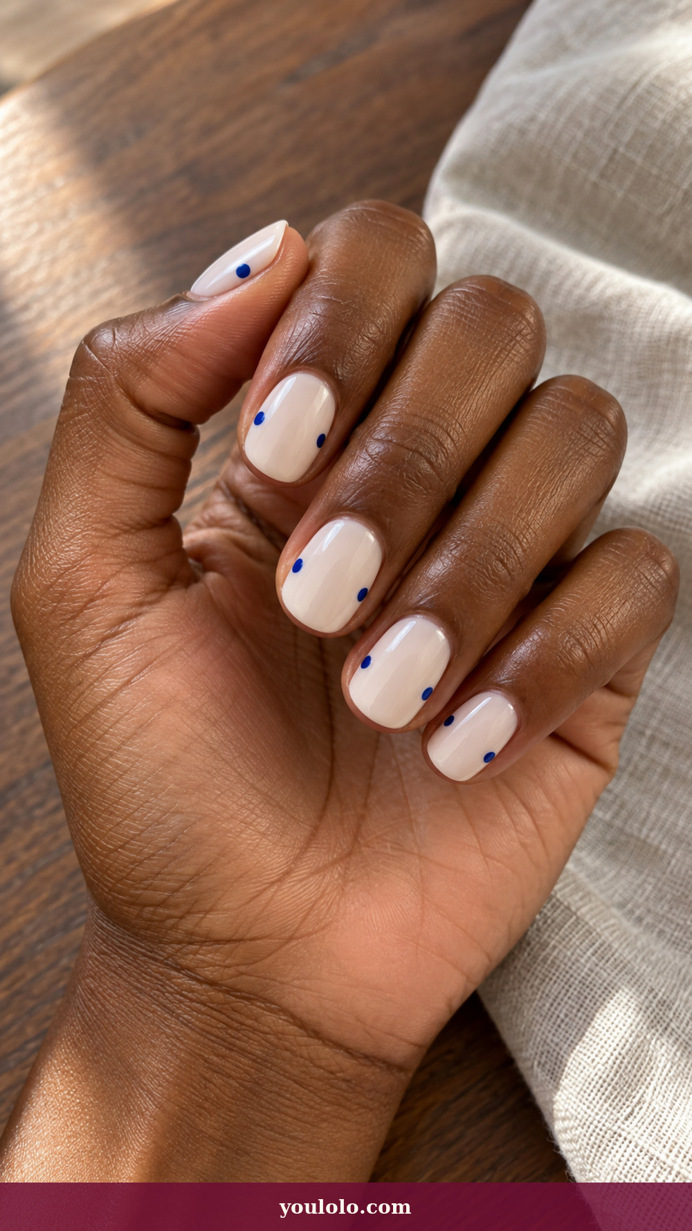Princess Nails idea 5: Blue Porcelain Dot on a realistic feminine hand