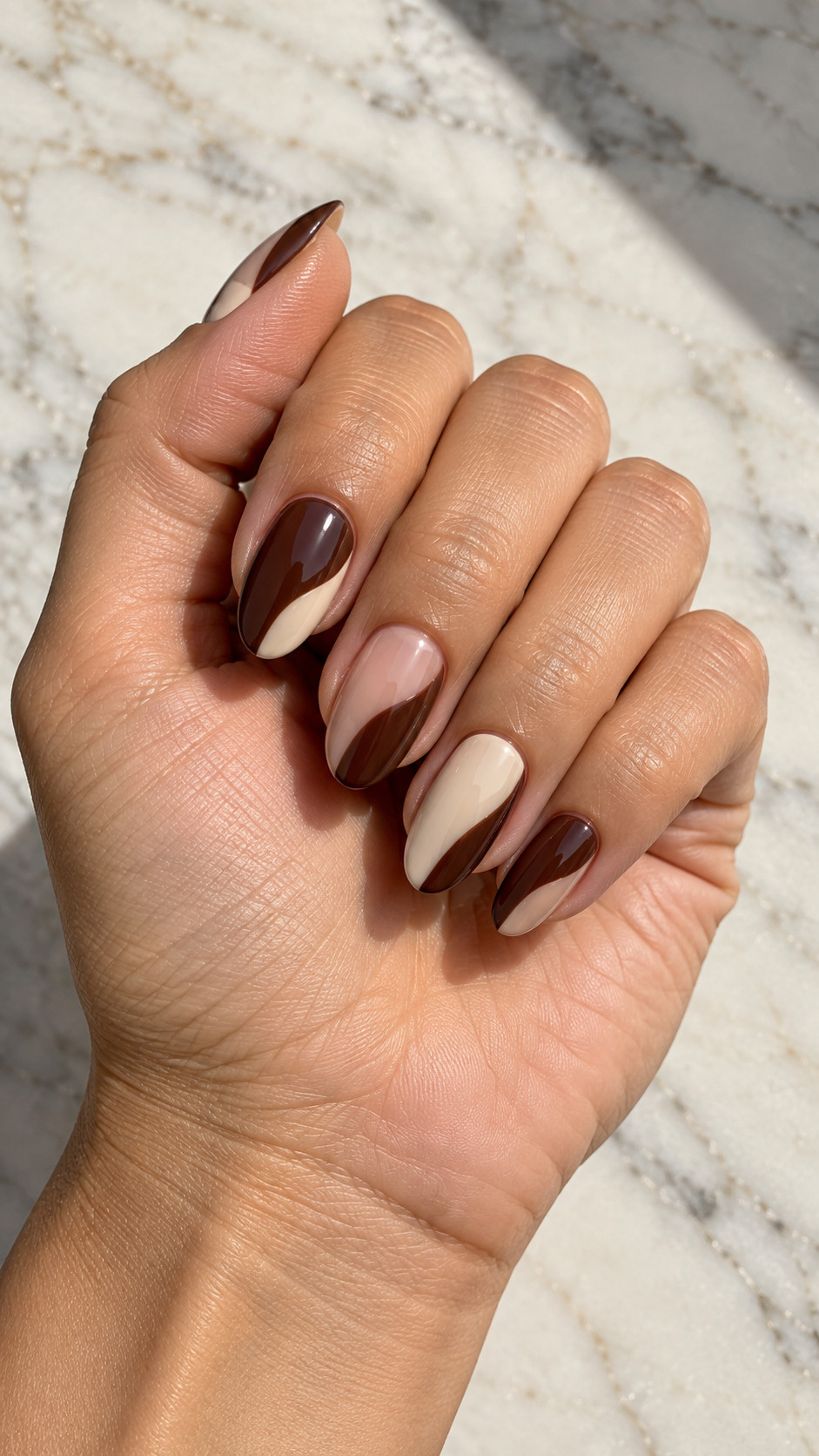 Chocolate Brown Nails idea 5: Chocolate and Cream Blocks manicure on a realistic feminine hand