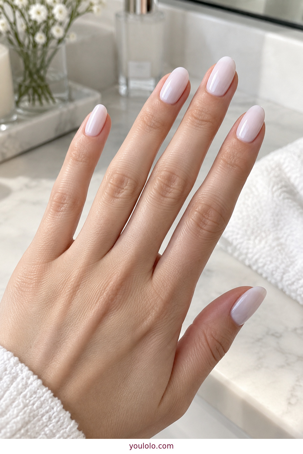 Cool cloud white translucent polish on oval nails