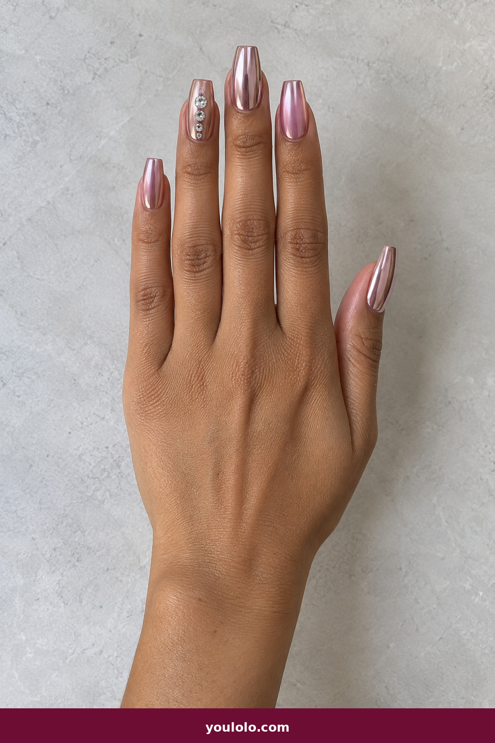 Pink Nails with Rhinestones on One Finger Ideas: Mirror Pink Chrome Cascade, Tapered-square pale rose mirror-chrome nails with a graduated five-stone crystal cascade on the ring finger.