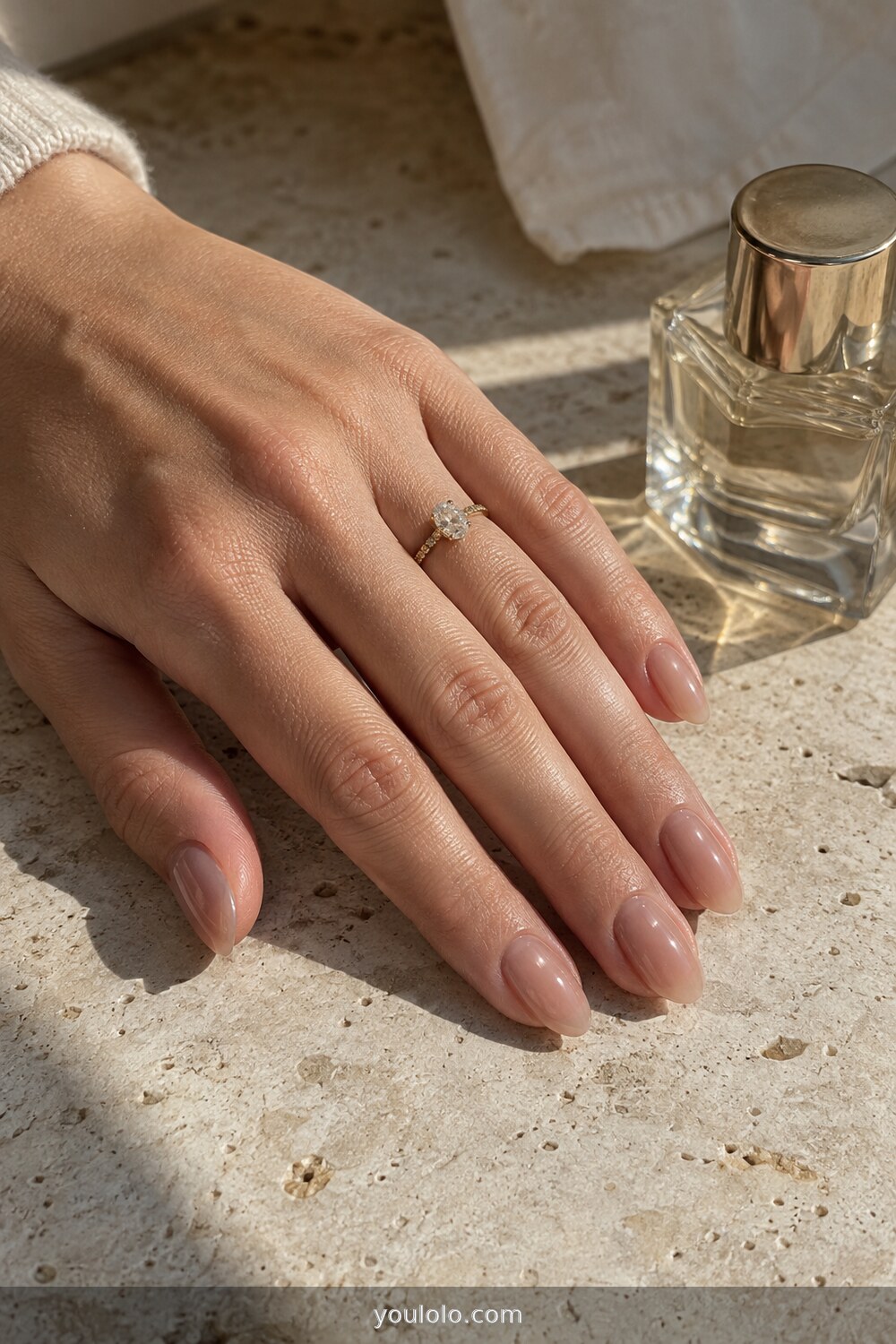 Warm nude jelly manicure on medium almond nails