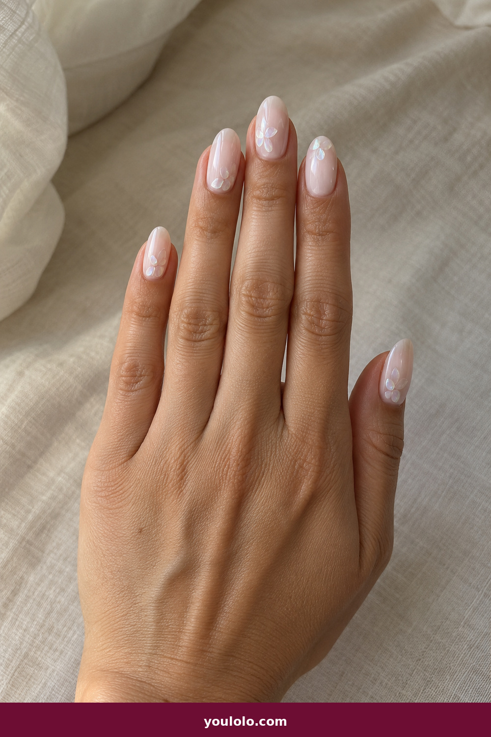 Elegant Almond Nails idea 5: Opal Petal, medium almond milky nails with tiny translucent opal petal accents