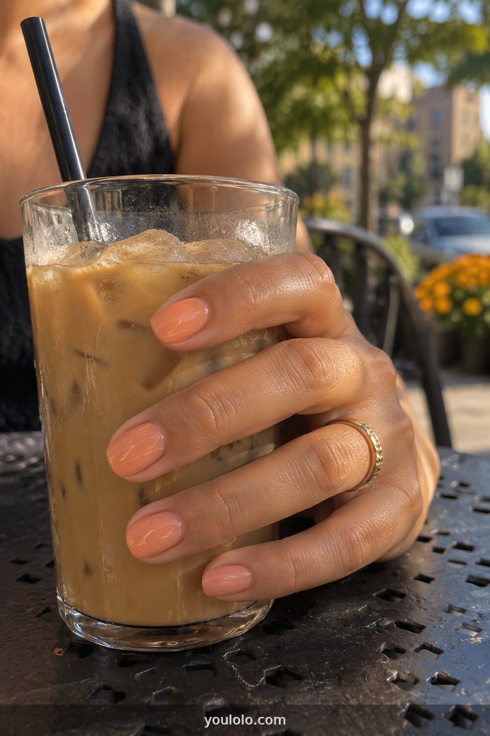 Toasted peach glossy short nails in outdoor light
