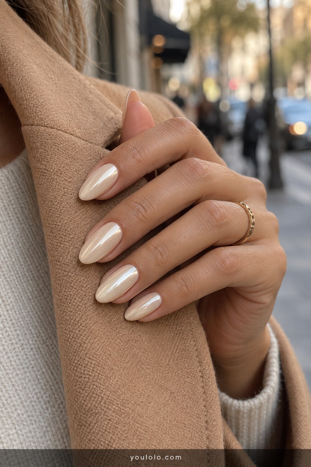 Vanilla ivory chrome almond nails with warm pearl glow