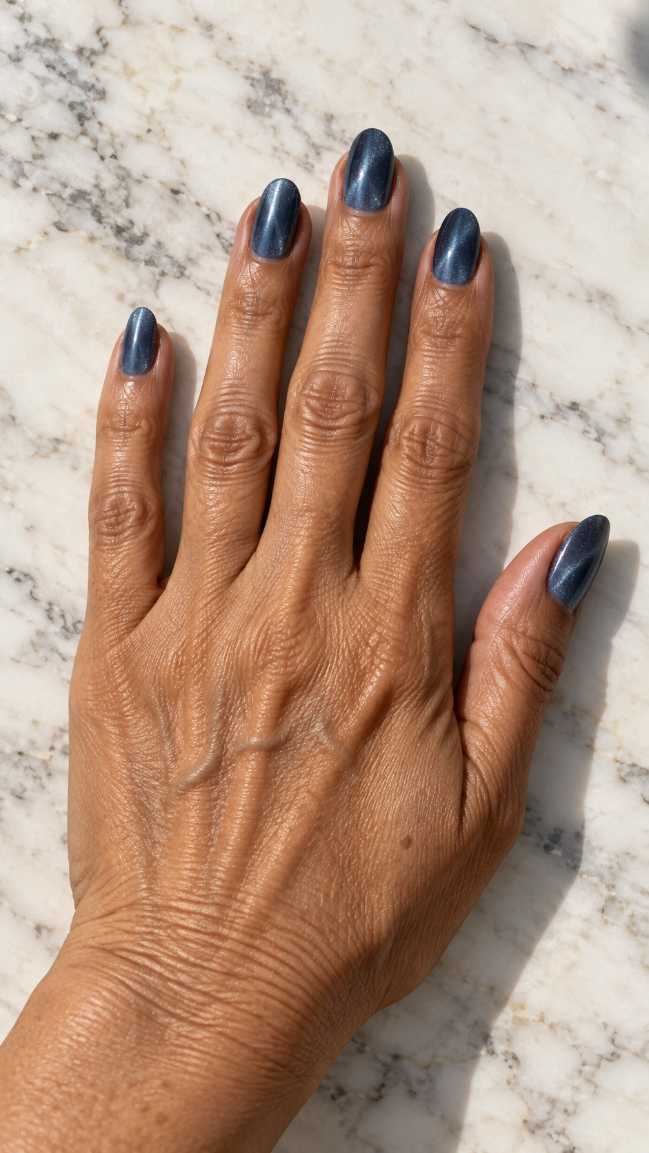 Velvet Nails idea 6: Blue Slate manicure on a realistic feminine hand