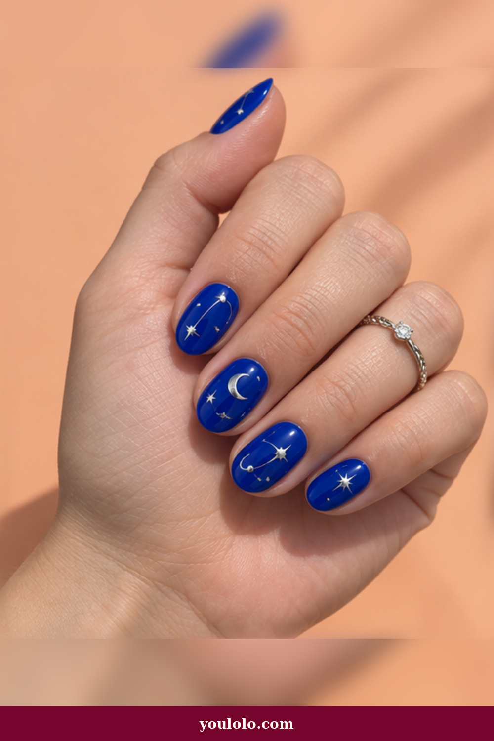 Festival Nails idea 6: cobalt celestial nail art with silver stars