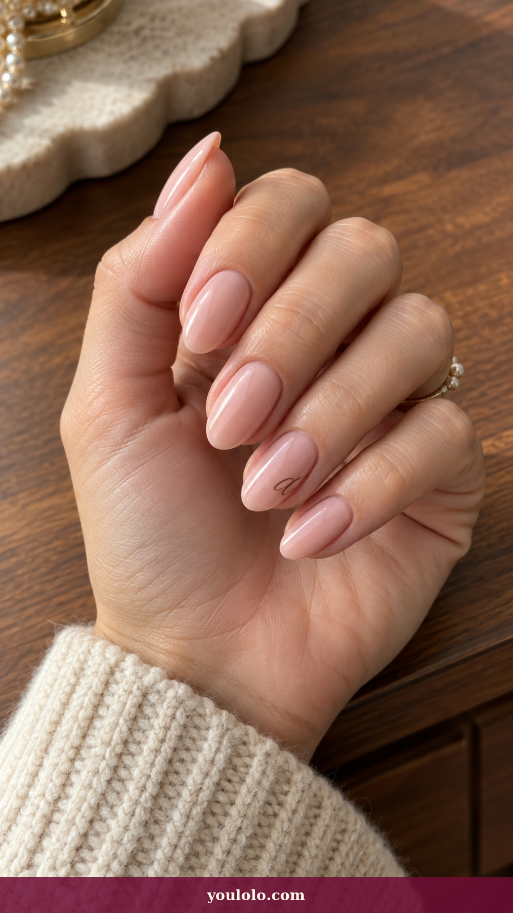 Initial Nails idea 6: Fine Lowercase Script on a realistic feminine hand