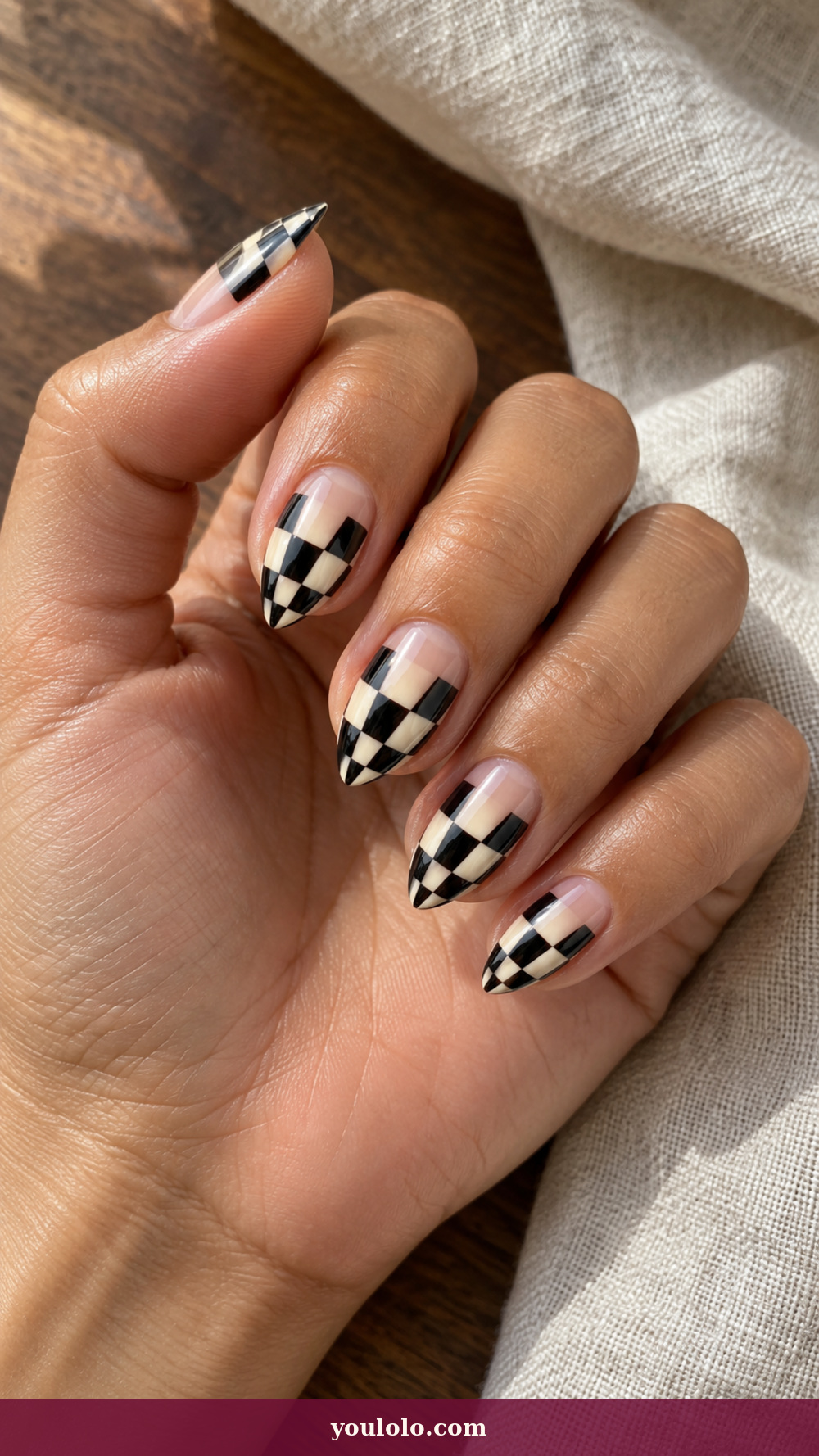 Short Stiletto Nails idea 6: Ivory Black Chessboard on a realistic feminine hand