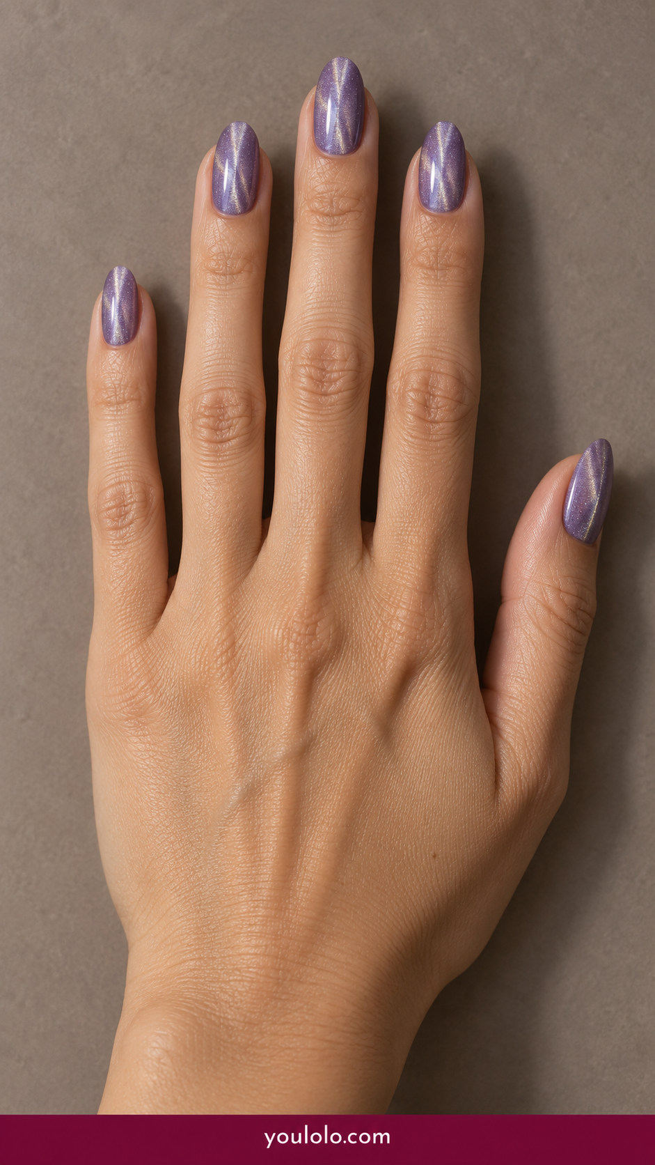 Cat Eye Nails idea 6: lavender magnetic cat-eye with fine cool silver center line on an anatomically realistic feminine hand