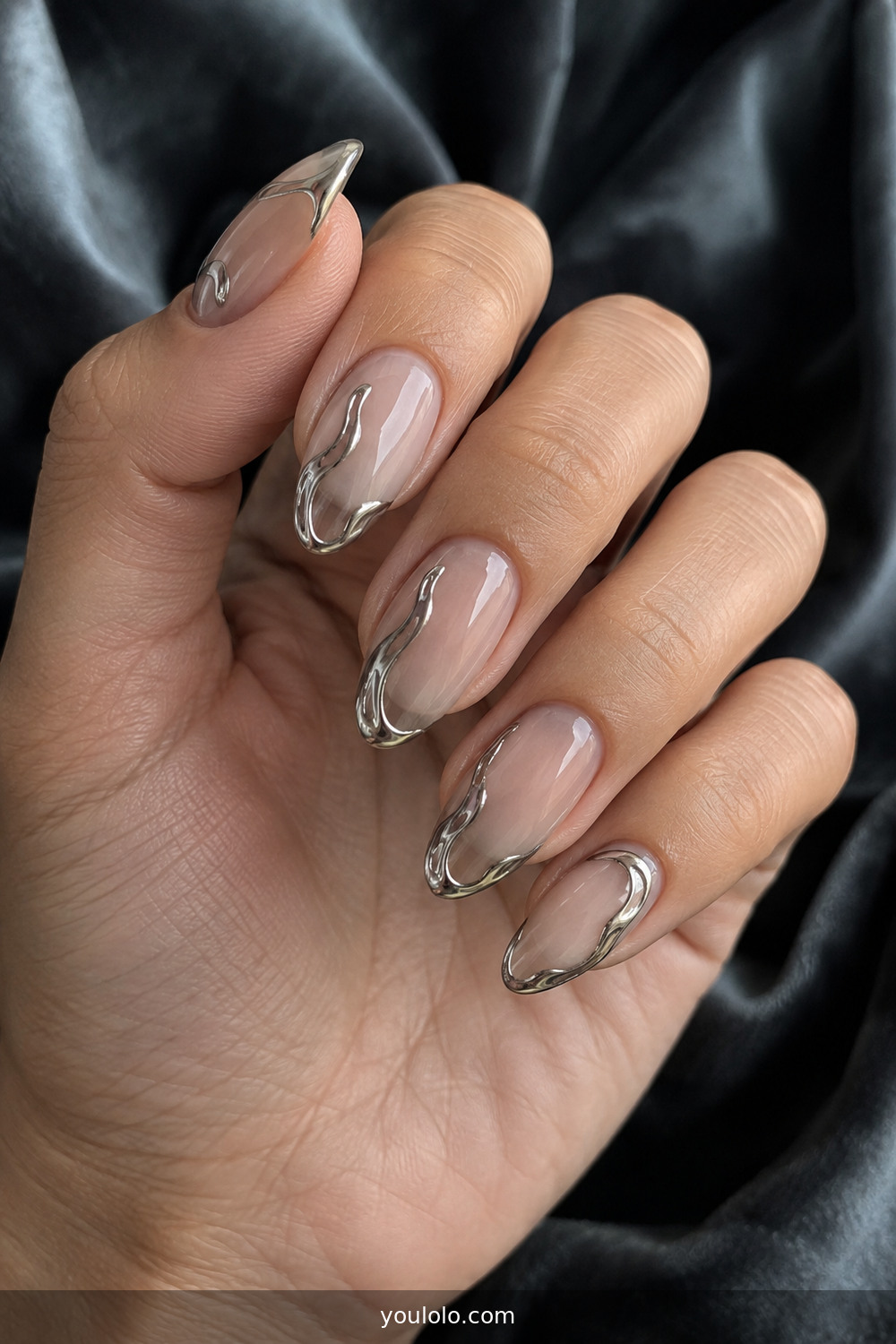 Sheer manicure with molten silver chrome accents