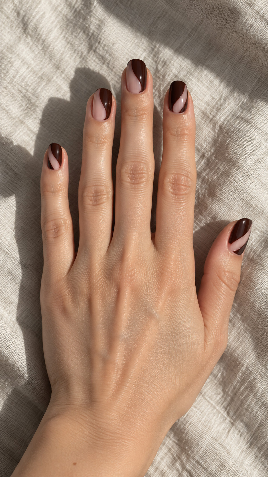 Chocolate Brown Nails idea 6: Open Brown Arches manicure on a realistic feminine hand