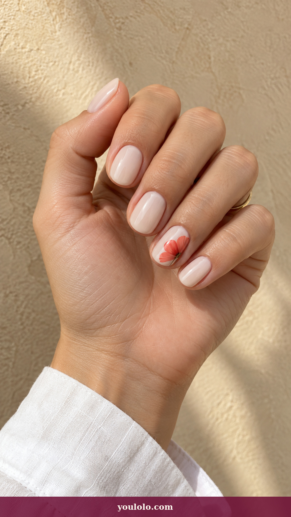 Simple Spring Nails idea 6: Poppy Petal Corner on a realistic feminine hand