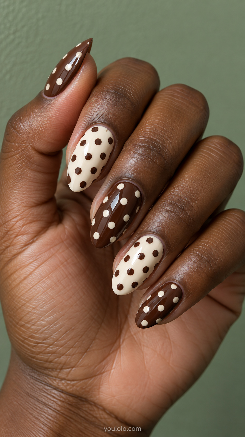Reversed cream dots on chocolate manicure