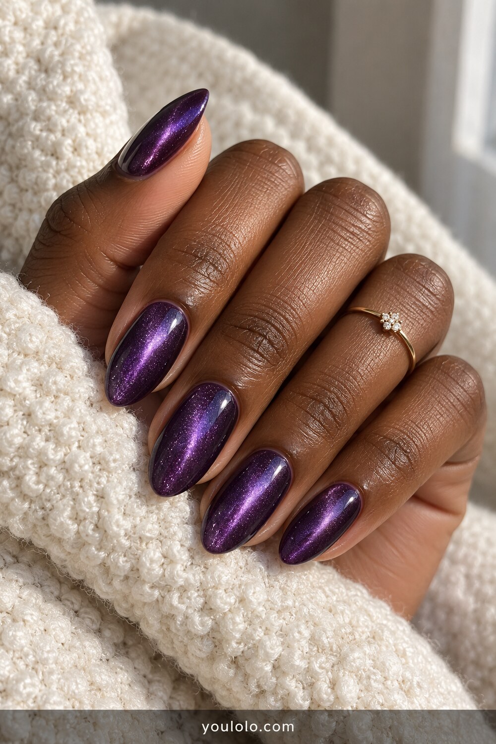 Amethyst cat eye chrome manicure on deep skin