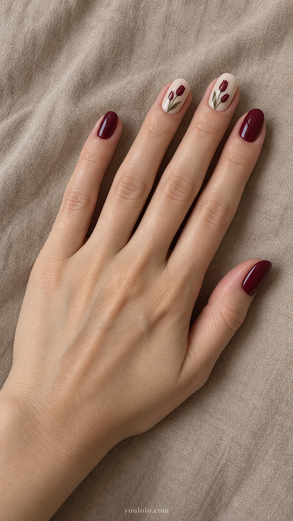 Burgundy Tulip Stems — Short oval nails; cream two accent nails with two narrow burgundy tulips and muted olive stems, wine others.