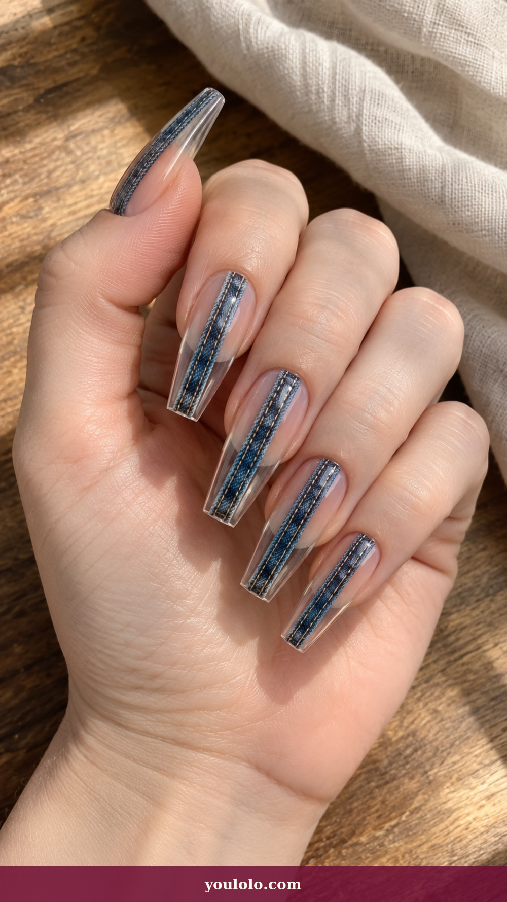 Acrylic Nails Ideas idea 7: Clear Denim Seam on a realistic feminine hand
