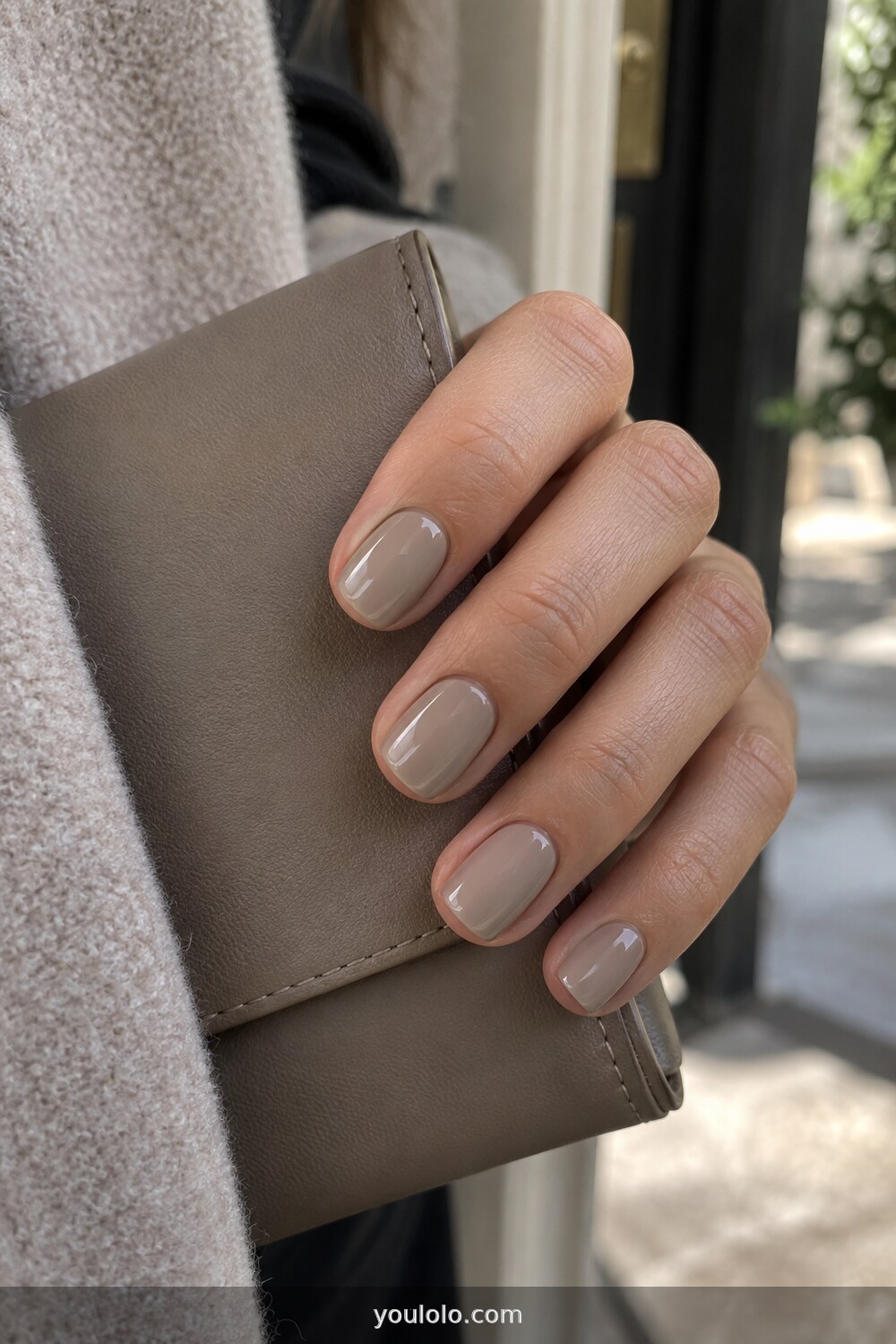 Glossy greige short nails for an elegant neutral manicure