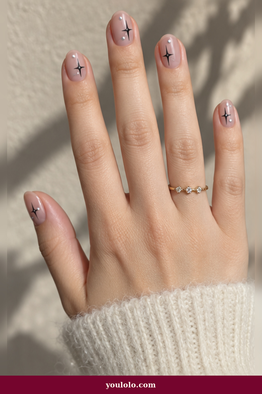 Emo Nails idea 7: sheer nude nails with tiny black stars and silver pinpoints
