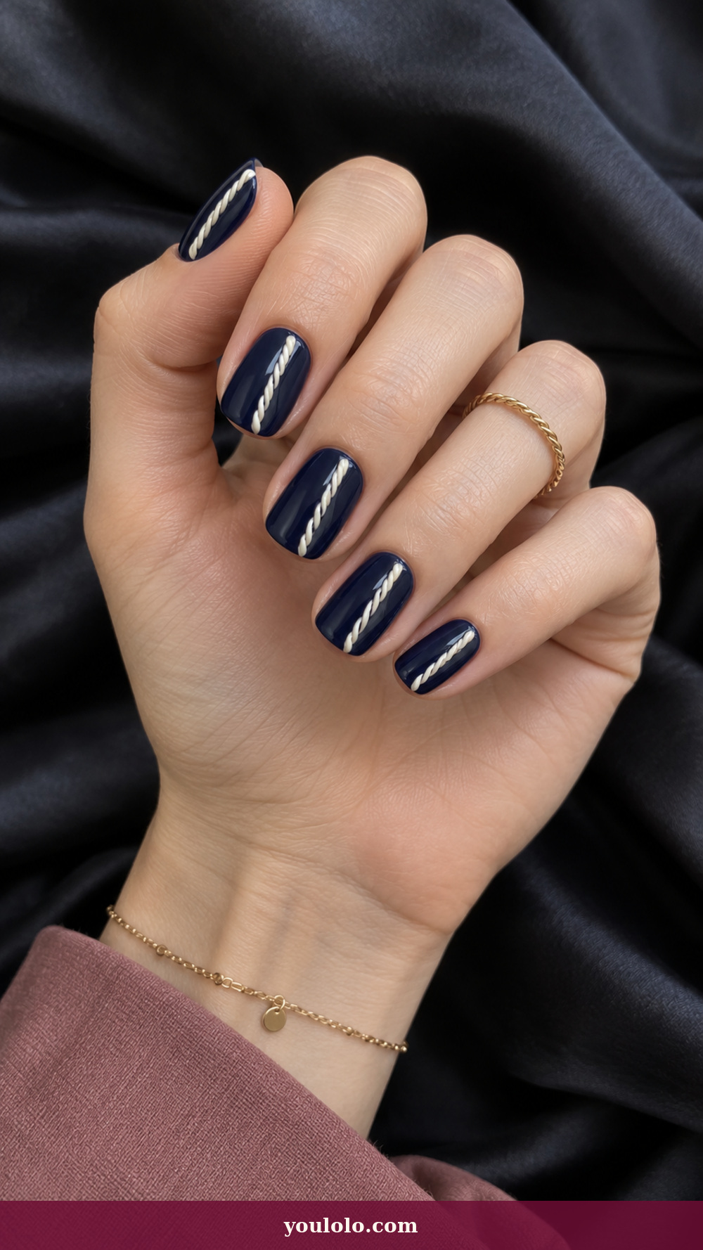 Blue and White Nails idea 7: Navy Rope Relief on a realistic feminine hand