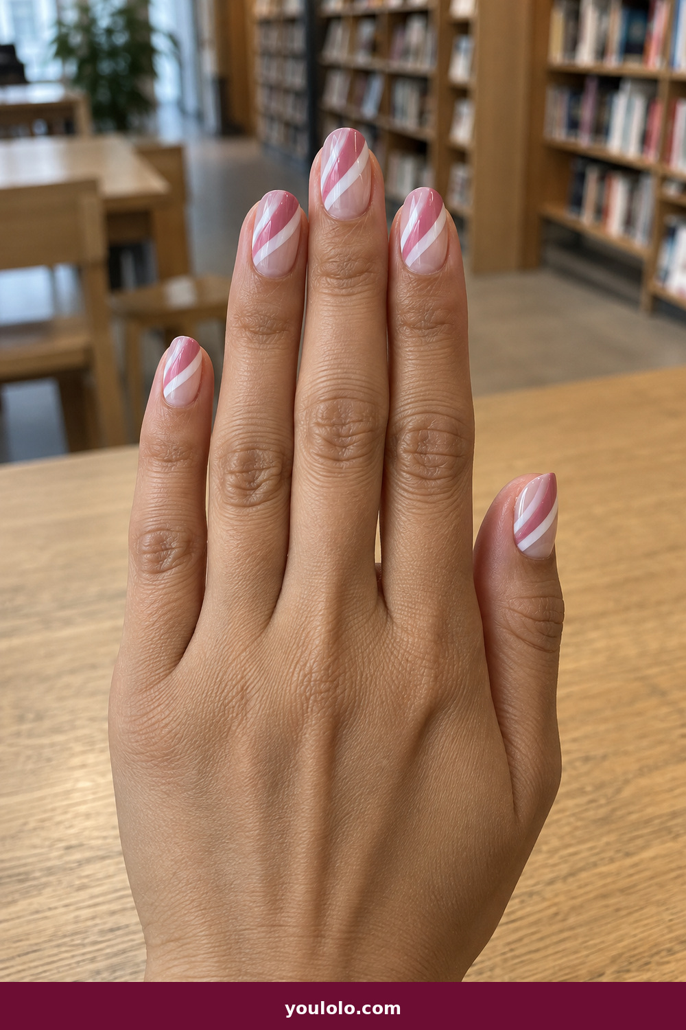 Pink and White Nails idea 7: Rose Stripe Negative Space, medium oval clear nails with crisp rose-pink and white diagonal stripes
