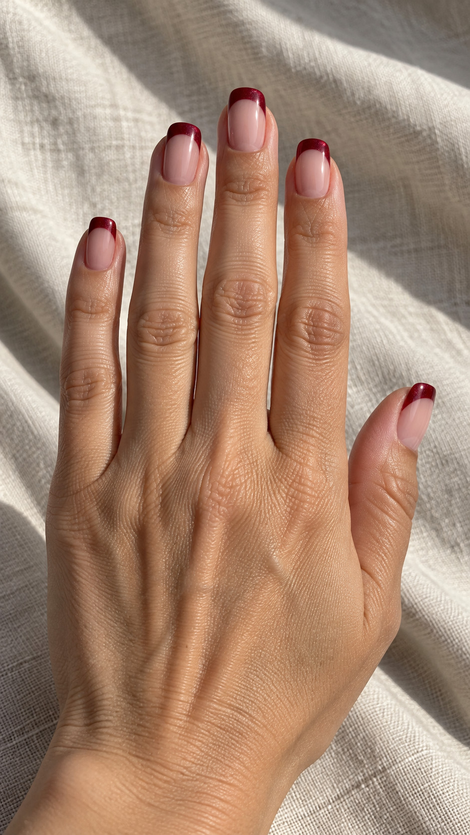 Velvet Nails idea 7: Ruby Velvet Tips manicure on a realistic feminine hand