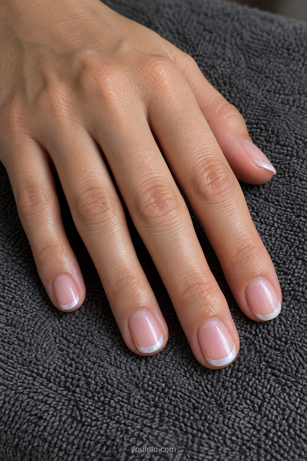 Short round nails with pearly white chrome French tips