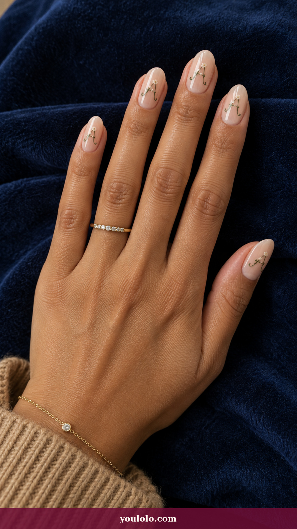 Initial Nails idea 8: Birth Flower Monogram on a realistic feminine hand