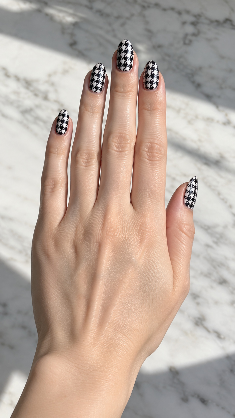 Plaid Nails idea 8: Black-and-White Houndstooth manicure on a realistic feminine hand