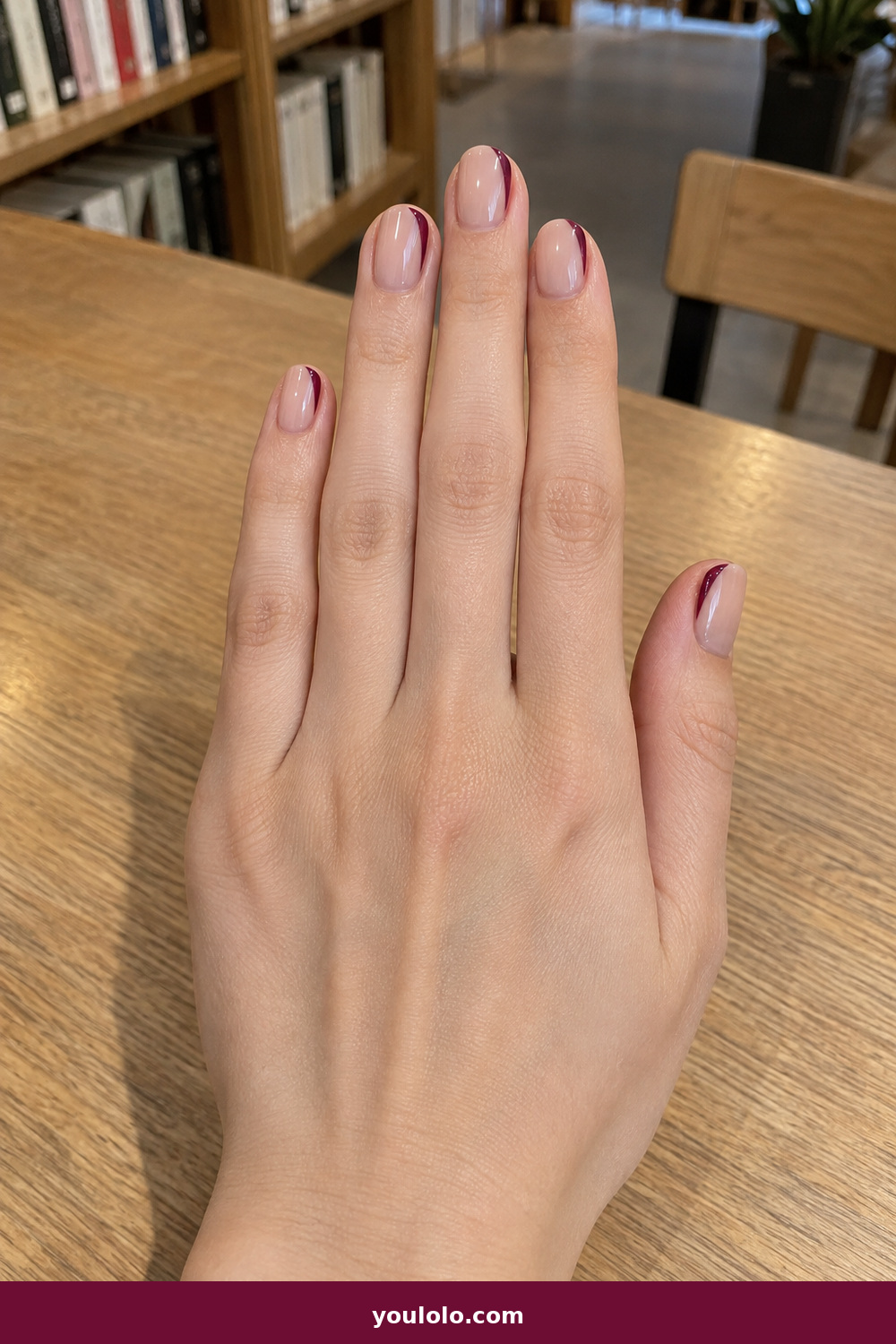 Work Nails idea 8: Burgundy Side French, short nude nails with slim burgundy side tips following one edge