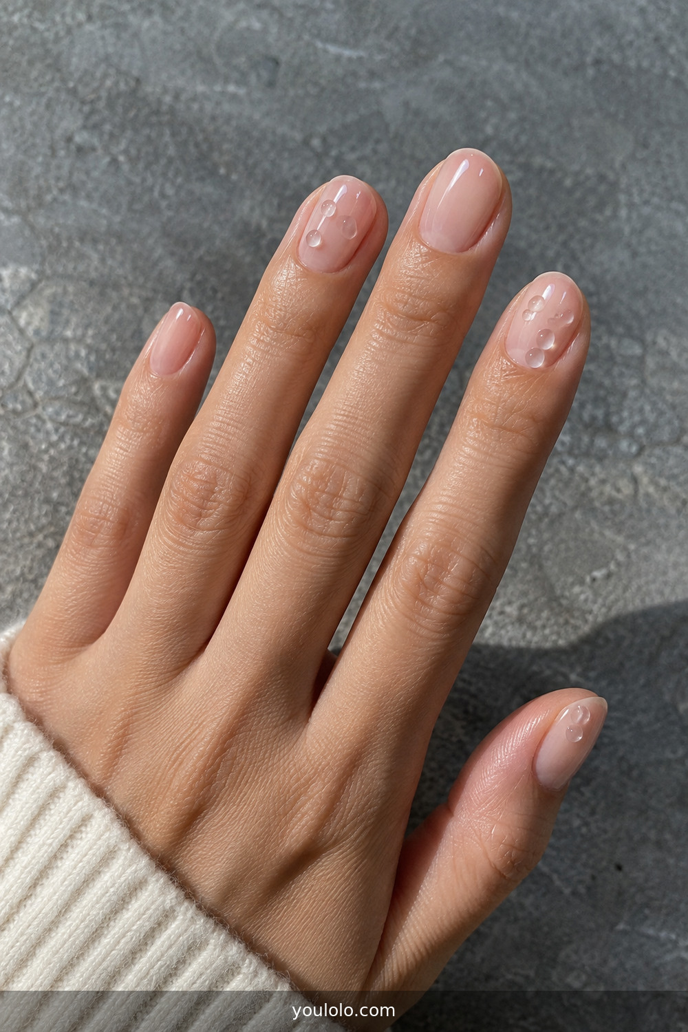 Clear glossy nails with small transparent gel dew drops